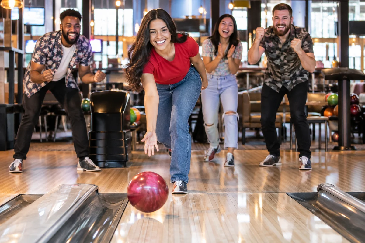 AI-generated bowling + games experience illustration; not a photograph of Main Event Olathe